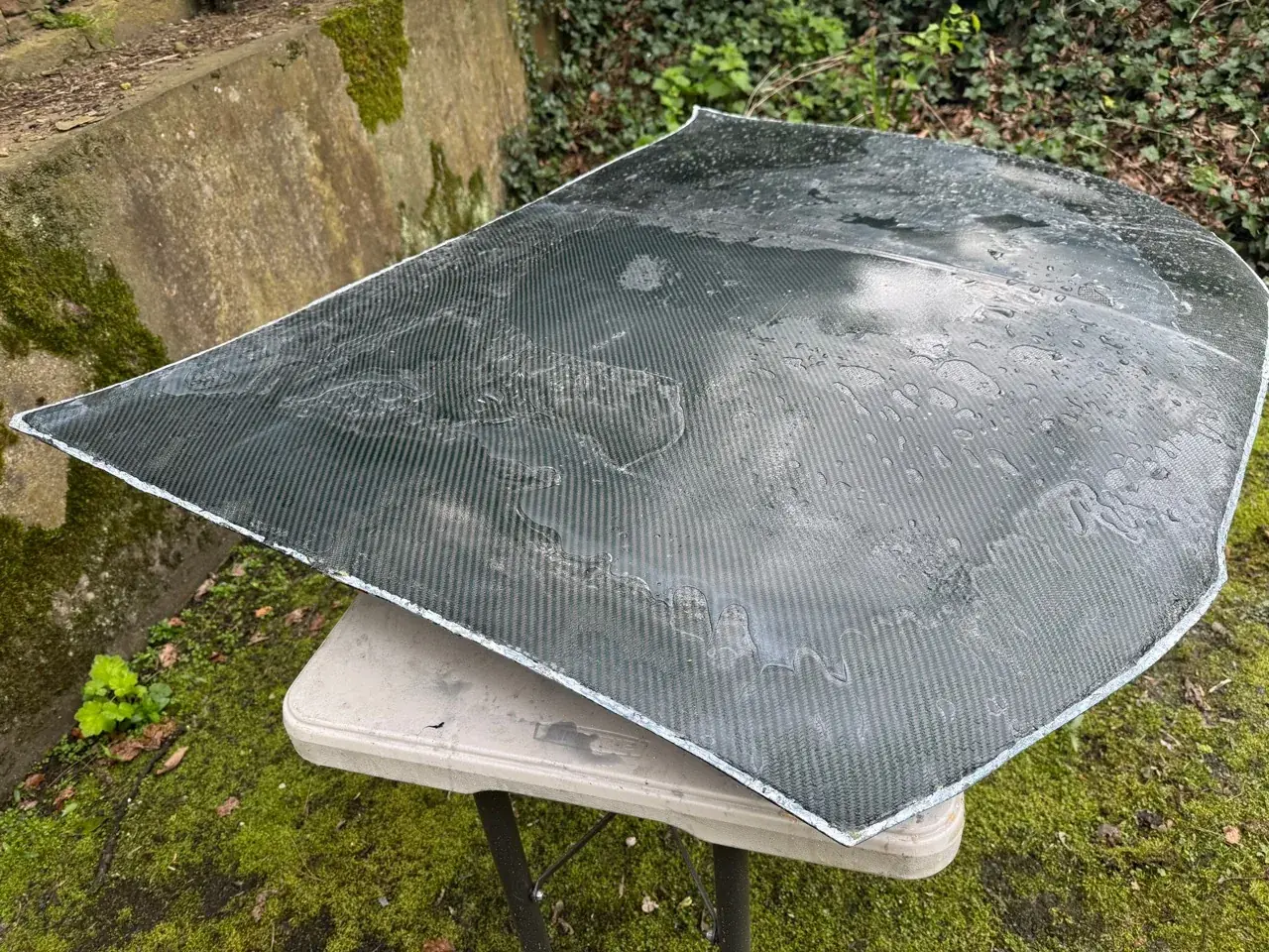Carbon fibre bonnet panel during an early build and surface stage