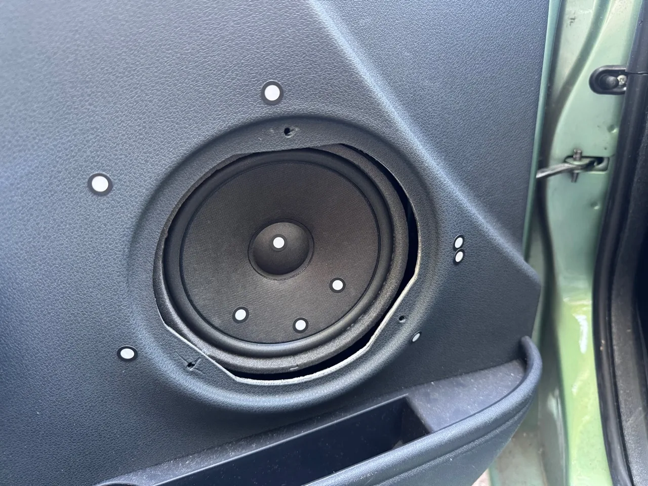 Original Rover 25 or MG ZR door-card speaker opening marked with scan targets before 3D capture